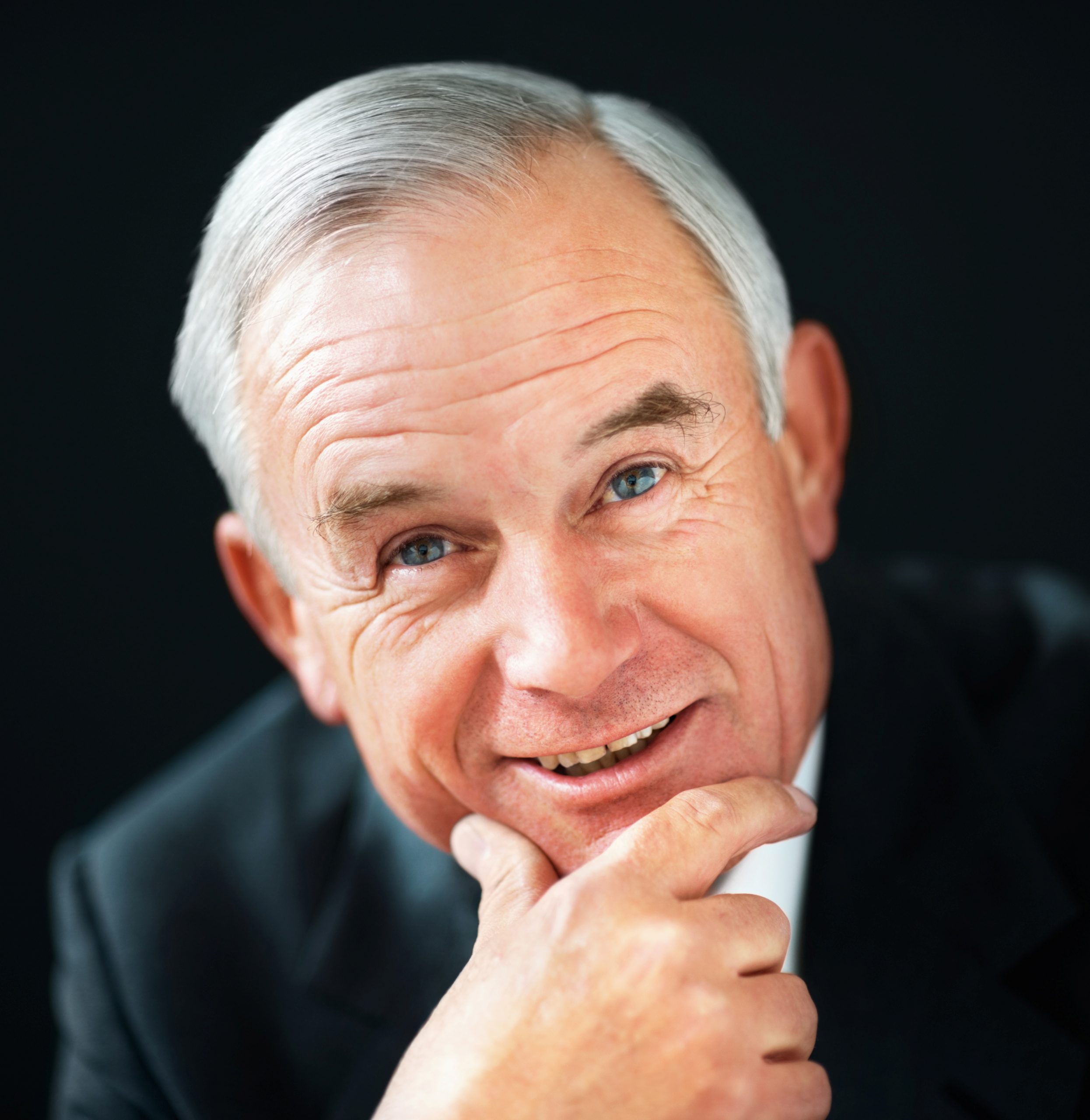 Closeup portrait of a smiling senior business man